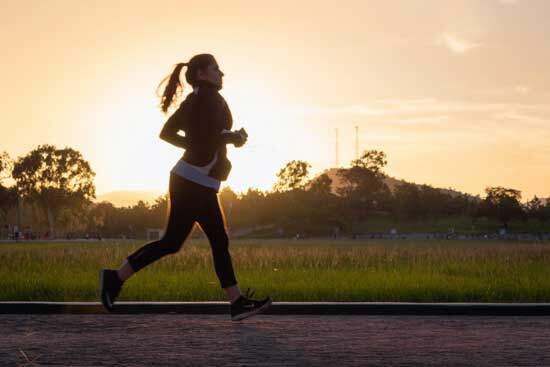 Woman running as part of her daily exercise since Adventists believe that consistent exercise can bring great health benefits