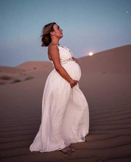A pregnant woman in a white dress, like the one Revelation 12 uses to symbolize God's people through whom the man child Jesus Christ came