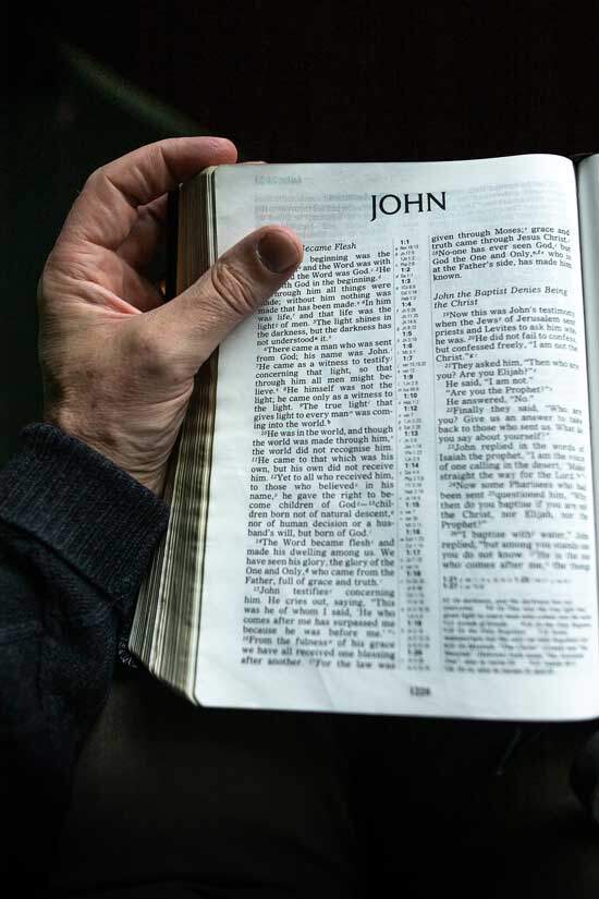 Bible open at John 1:1-3 - “In the beginning was the Word [Jesus], and the Word was with God, and the Word was God.