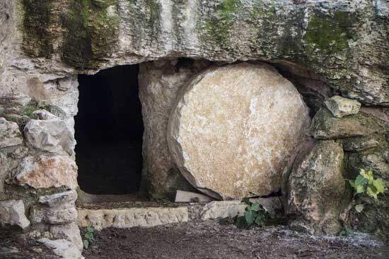 Empty tomb of Jesus Christ with the stone rolled away at His resurrection when He conquered death & gave us hope of eternity