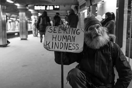 A homeless man seeking human kindness