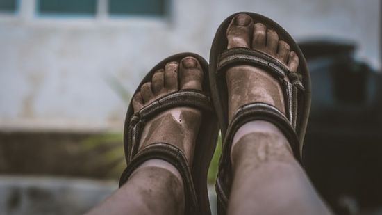 Dirty feet with sandals as we discuss the importance of hygiene and bathing in the Bible to avoid disease and maintain health