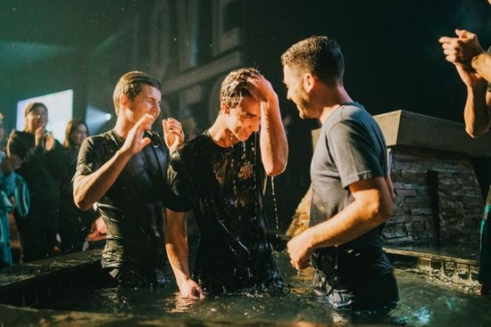 A pastor performing a baptism
