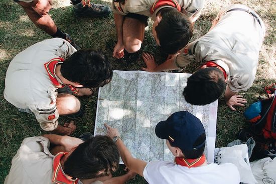 Adventist young people looking at a map for an activity