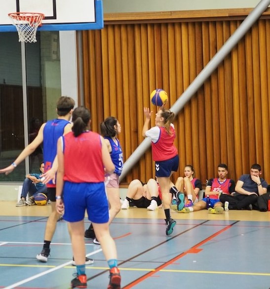 Adventist students playing basketball as part of an athletics program