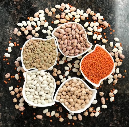 An assortment of dry beans and lentils on a table