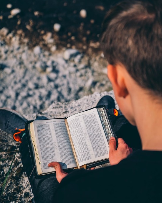 A man reading the Bible to find assurance about end-time events