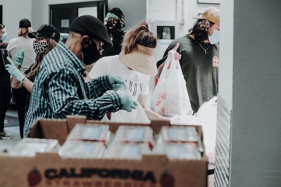 People receiving help at a food drive put on by Christians