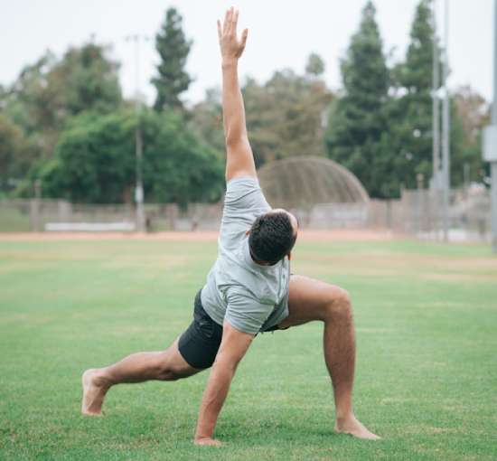 A man stretches for his daily exercise routine.