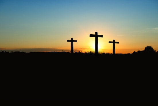 Three crosses in the sunset