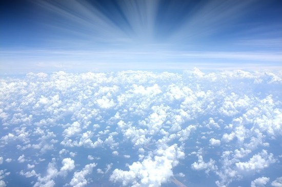 Bright sunshine over clouds in the sky