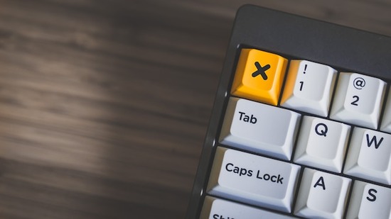 A keyboard with a yellow delete button
