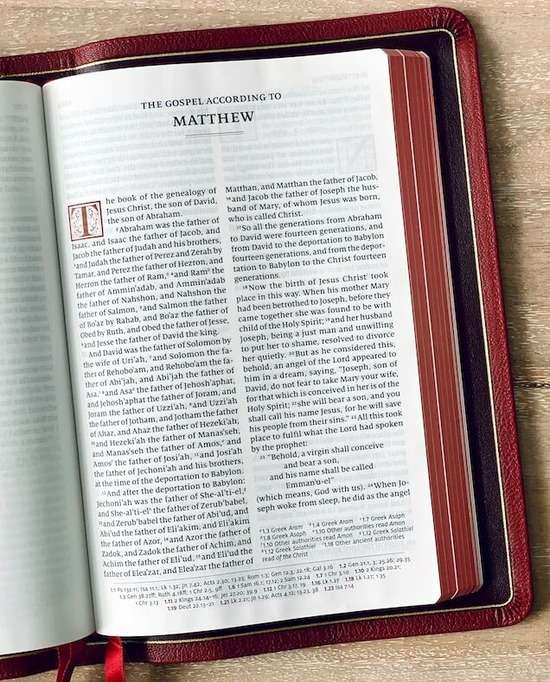 A leather Bible opened up to the Book of Matthew where it describes the birth of Jesus.