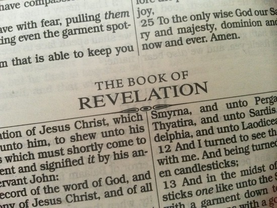 A Bible open to the book of Revelation which discusses the mark of the beast