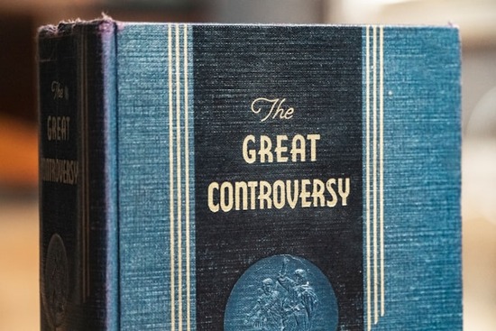The cover of an old copy of Ellen White's book, The Great Controversy.