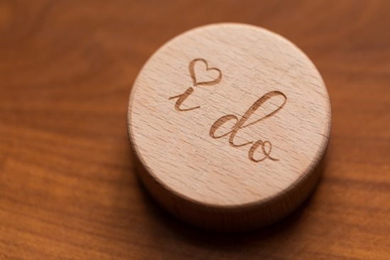 A wooden table decoration inscribed with the words, 'I do.'