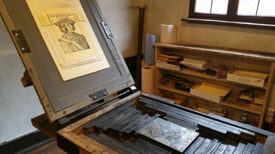 An old printing press, representing Gutenberg's invention in the 1440s