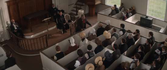 A scene from The Hopeful depicts church members sitting in their pews, listening to William Miller speak.