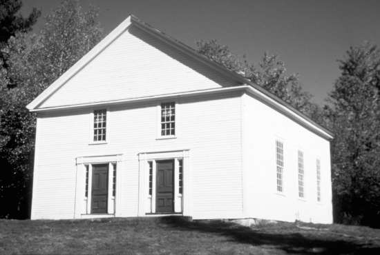 A black and white photo of an old Adventist church in New Hampshire.