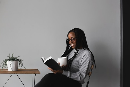 A woman reading a Bible as a way to grow her relationship with Jesus
