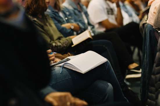 A group of people studying the Bible together