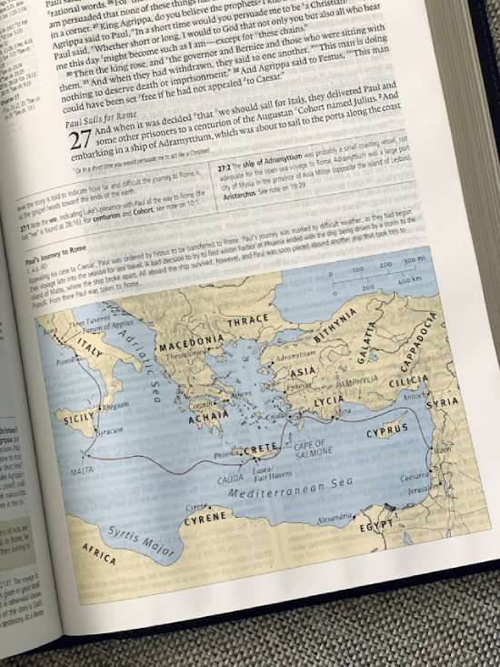 A study Bible open to a map of Paul's journey to Rome